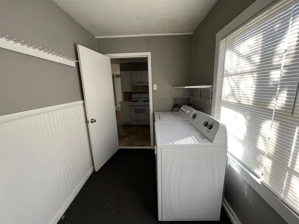 a view of a storage & utility room with a window