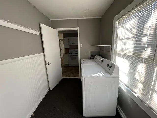 a view of a storage & utility room with a window