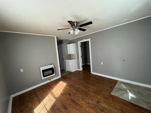 a view of livingroom with hardwood floor and a ceiling fan