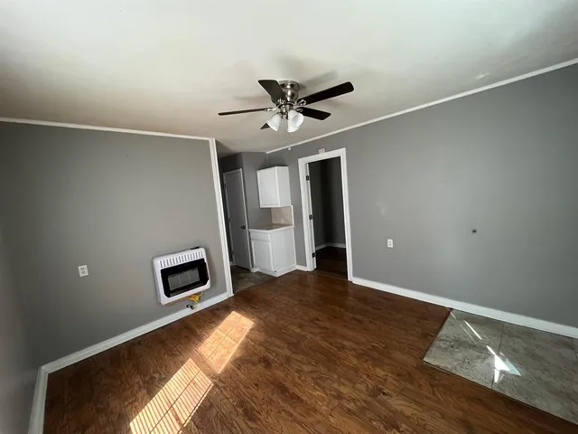 a view of livingroom with hardwood floor and a ceiling fan