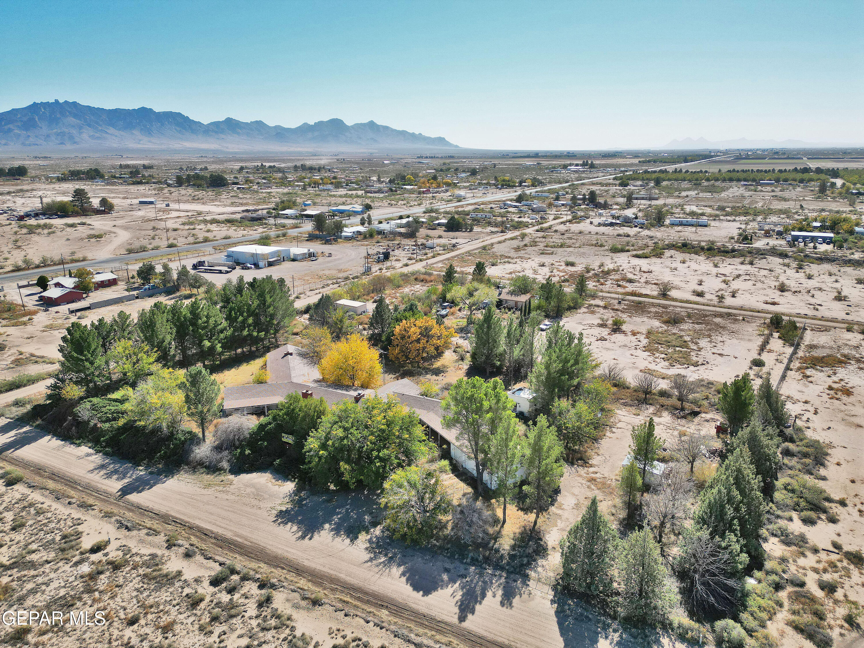 an aerial view of residential house and green space