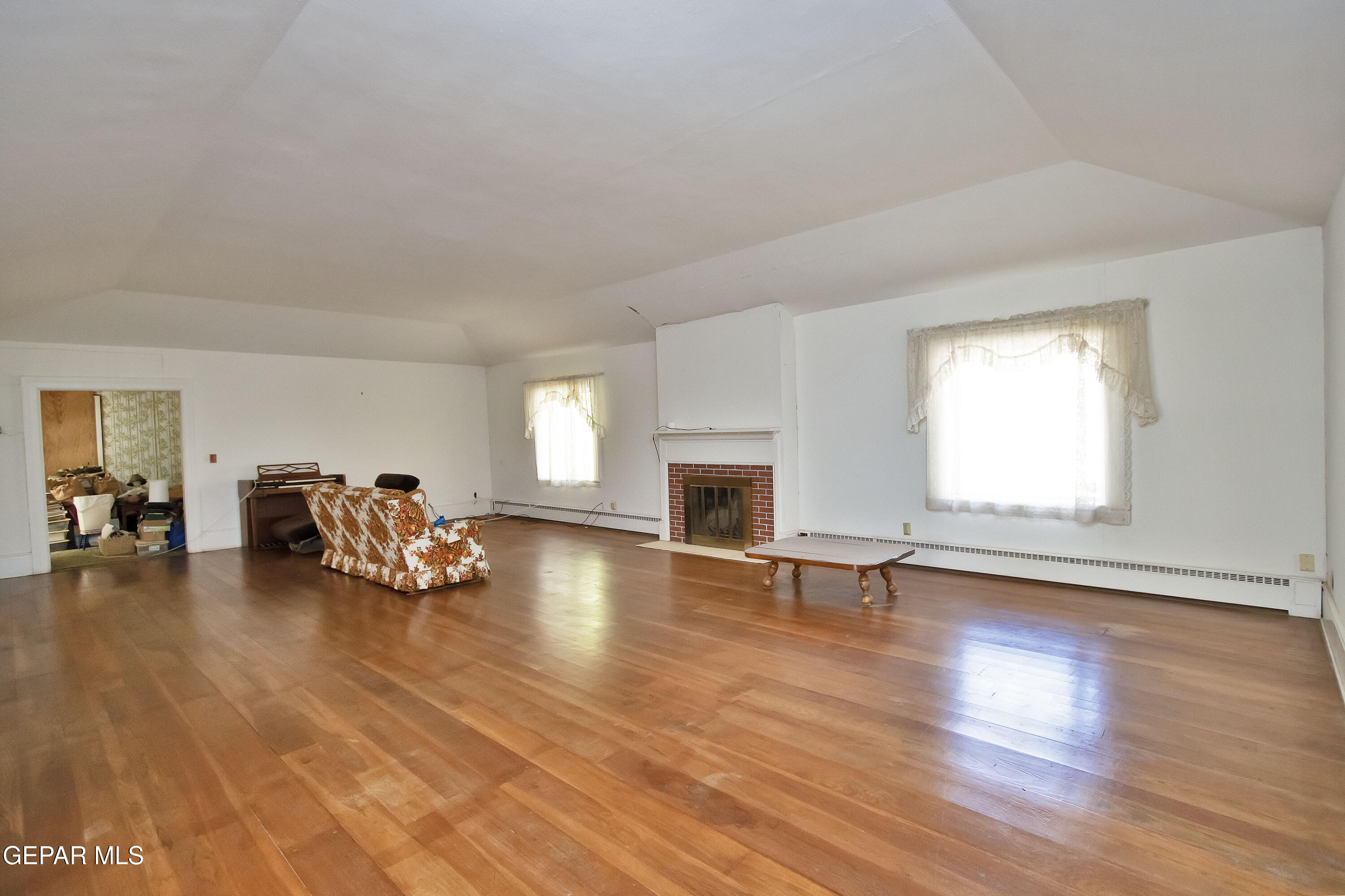 110 Southwest Creosote Road Out Of Service Area, OUT OF SERVICE AREA 99999 - Photo 17 of 101 a view of a livingroom with furniture a fireplace and wooden floor
