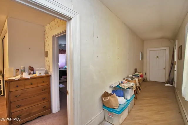 a view of a bathroom from a hallway