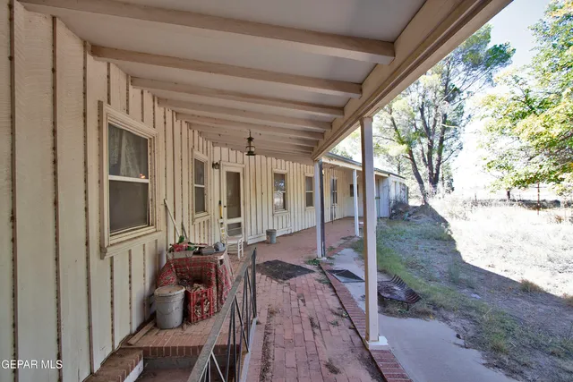 a view of a hallway with a dining room