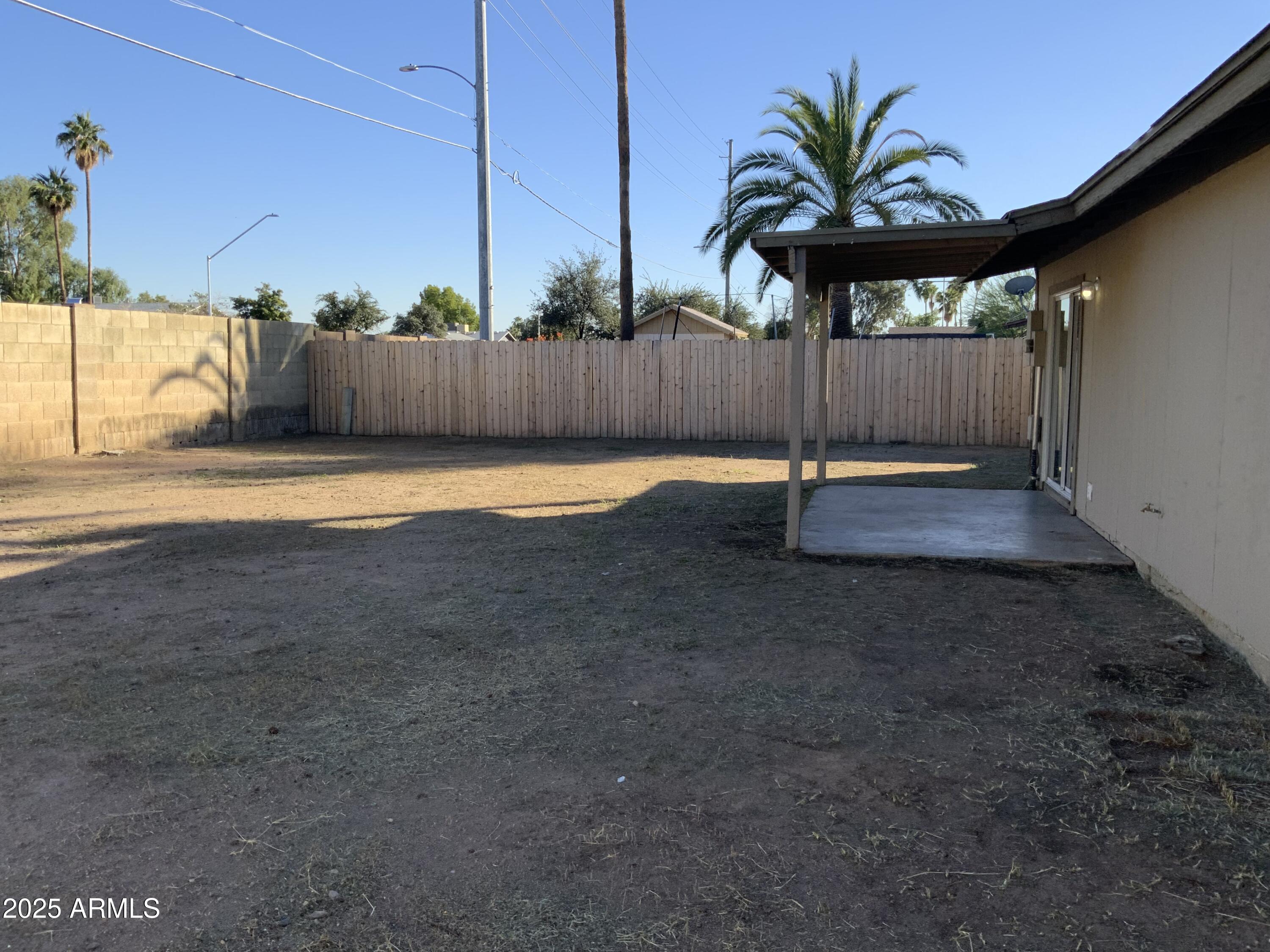 15831 North 59th Circle Glendale, AZ 85306 - Photo 11 of 12 a backyard of a house with lots of green space