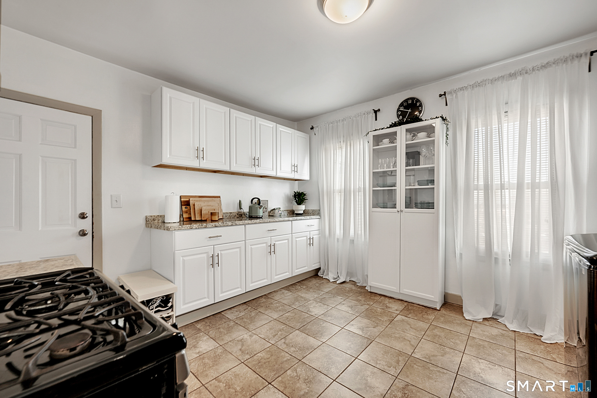 112 Austin Street New Britain, CT 06051 - Photo 11 of 40 a kitchen with a stove and a refrigerator