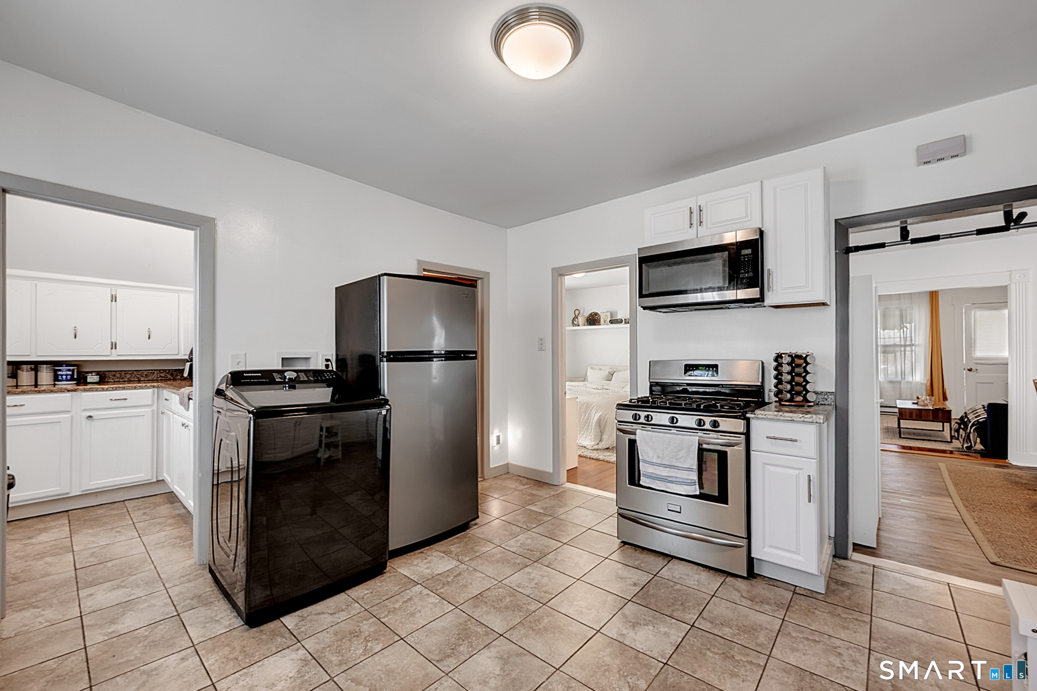 112 Austin Street New Britain, CT 06051 - Photo 15 of 40 a kitchen with a stove top oven and refrigerator