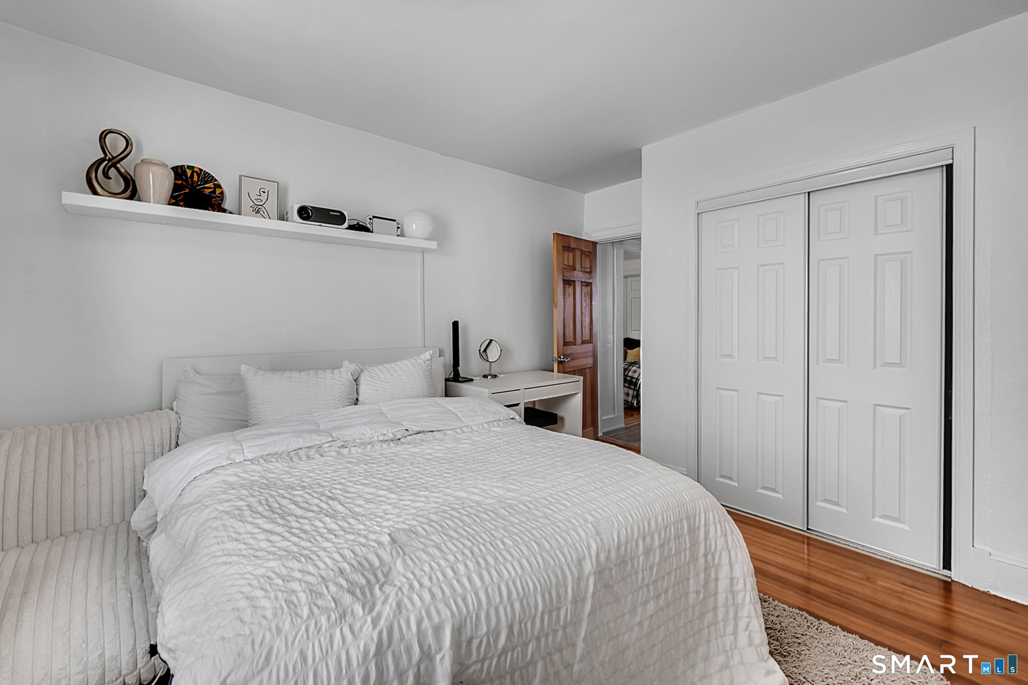 112 Austin Street New Britain, CT 06051 - Photo 20 of 40 a bedroom with a bed and cabinets