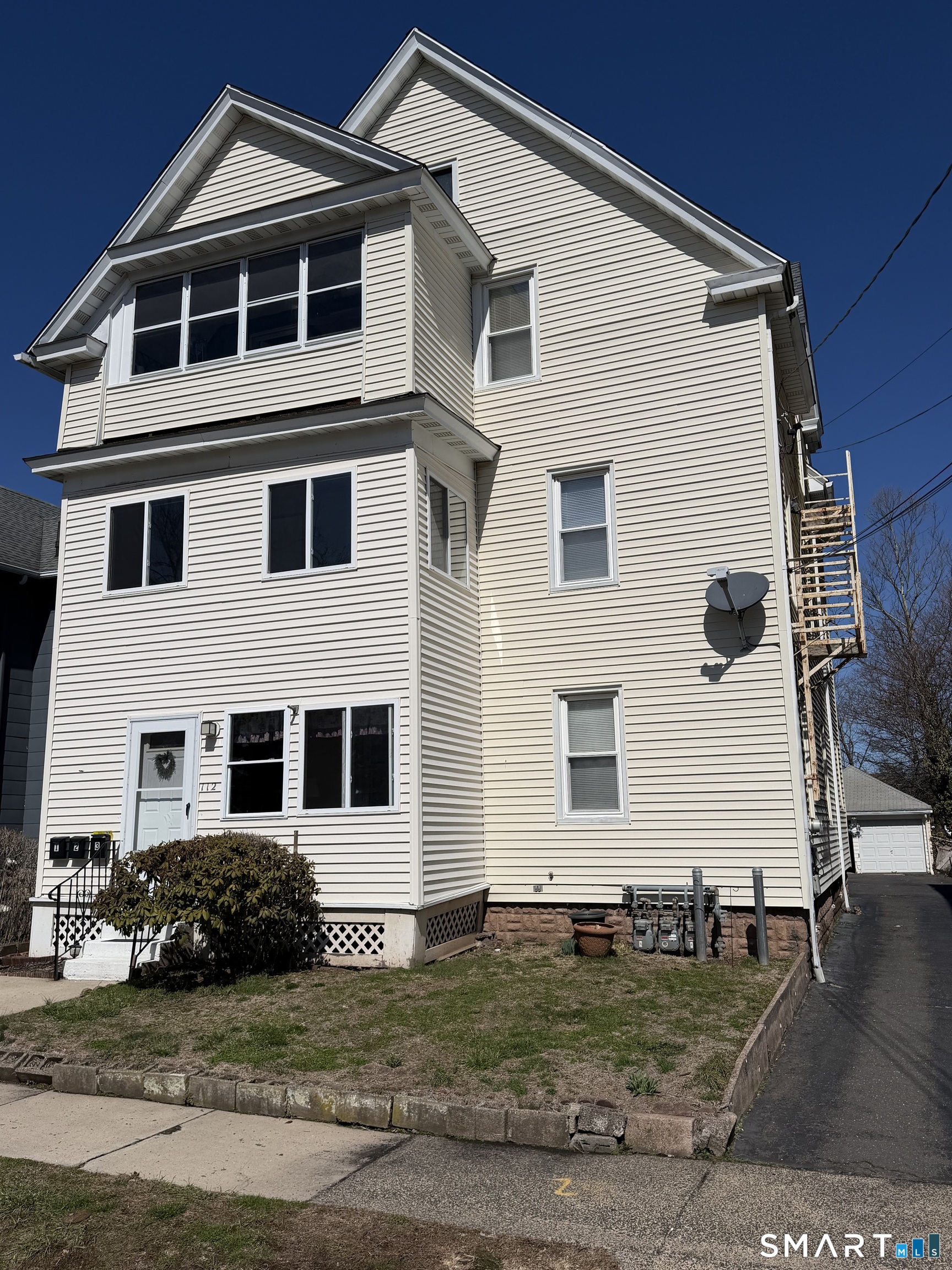 112 Austin Street New Britain, CT 06051 - Photo 2 of 40 a front view of a house with a yard