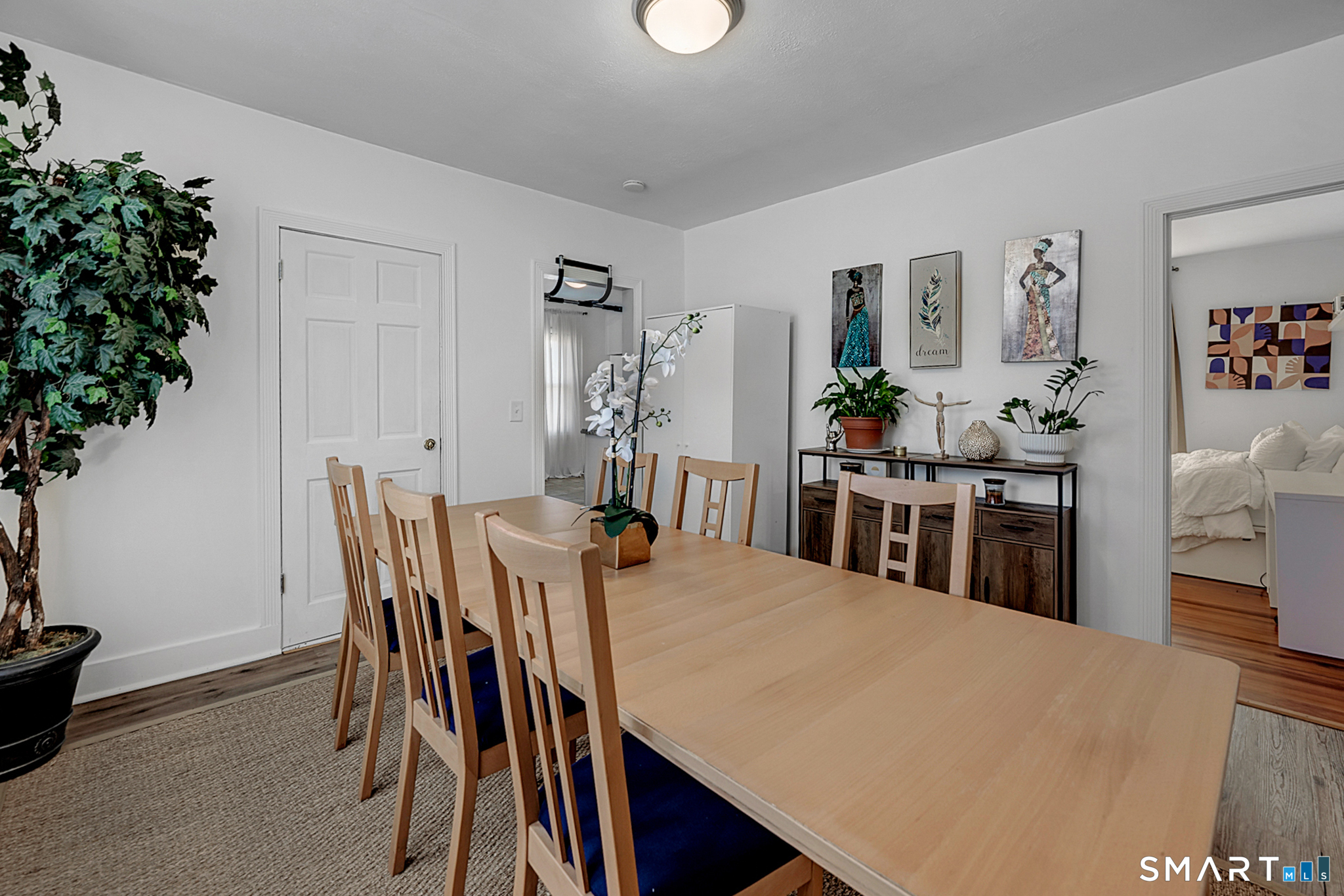 112 Austin Street New Britain, CT 06051 - Photo 23 of 40 a view of a dining room with furniture and wooden floor