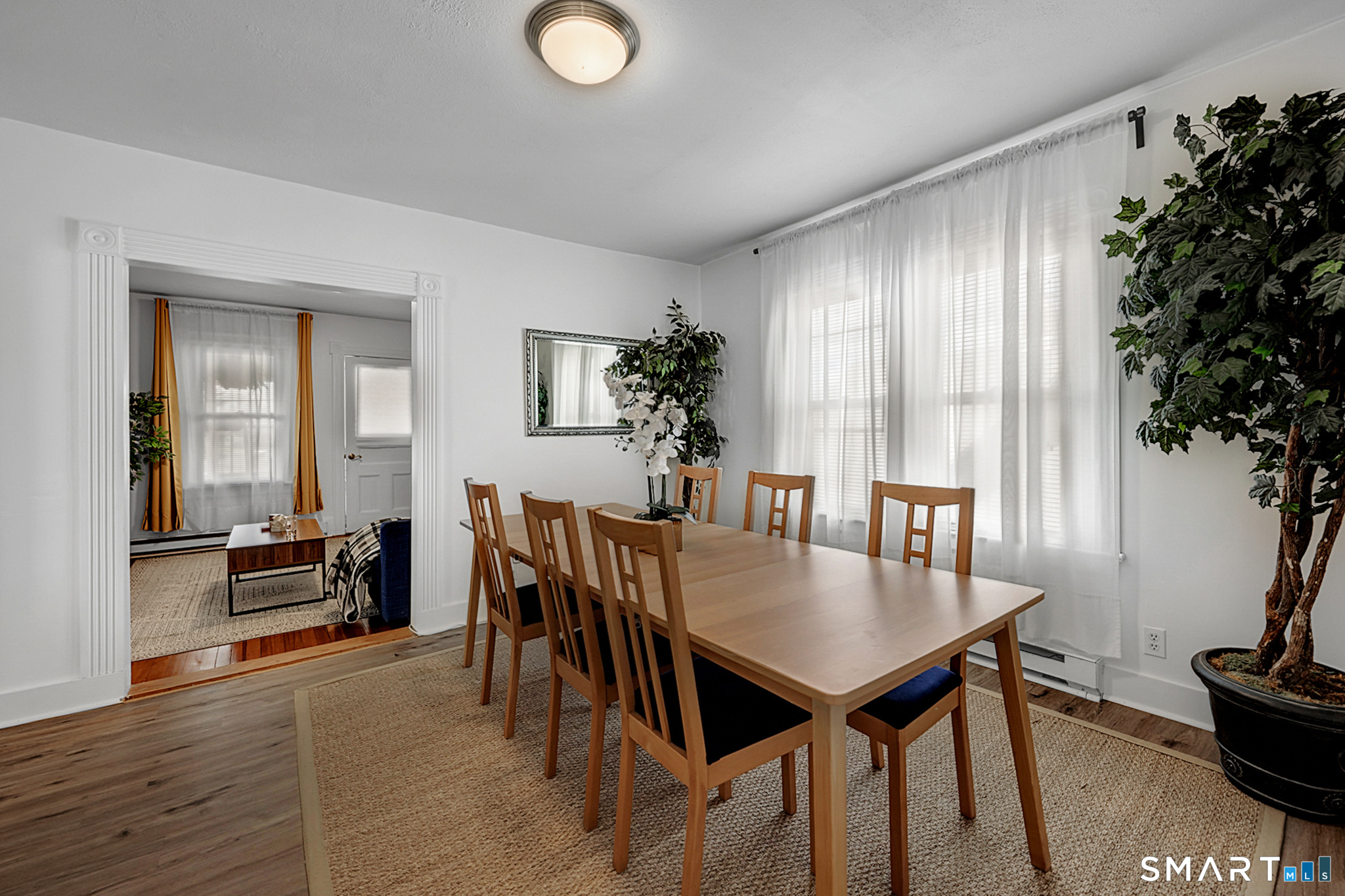 112 Austin Street New Britain, CT 06051 - Photo 24 of 40 a view of a dining room with furniture and wooden floor