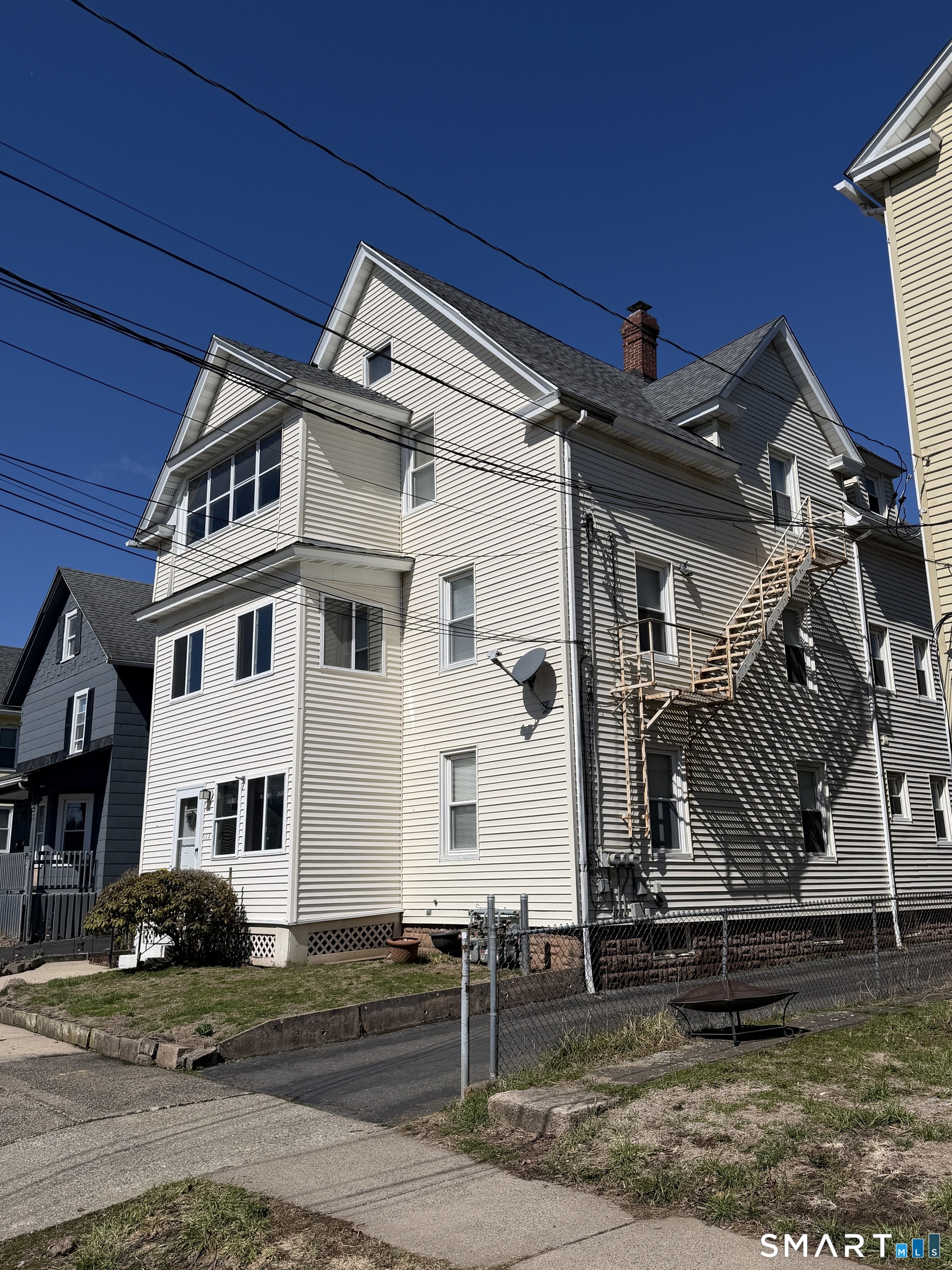 112 Austin Street New Britain, CT 06051 - Photo 4 of 40 a front view of a house with stairs