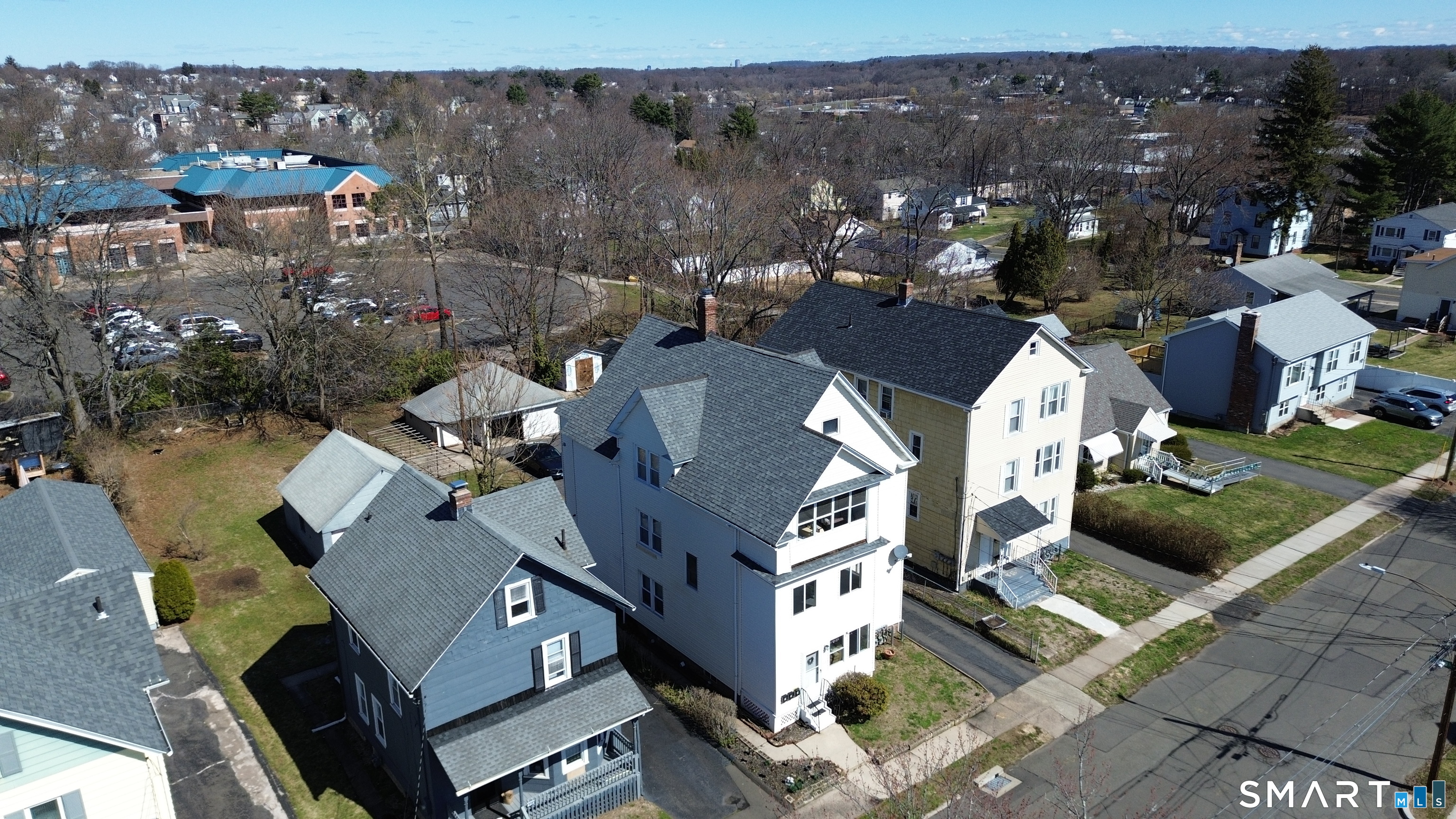 112 Austin Street New Britain, CT 06051 - Photo 6 of 40 an aerial view of multiple houses with yard