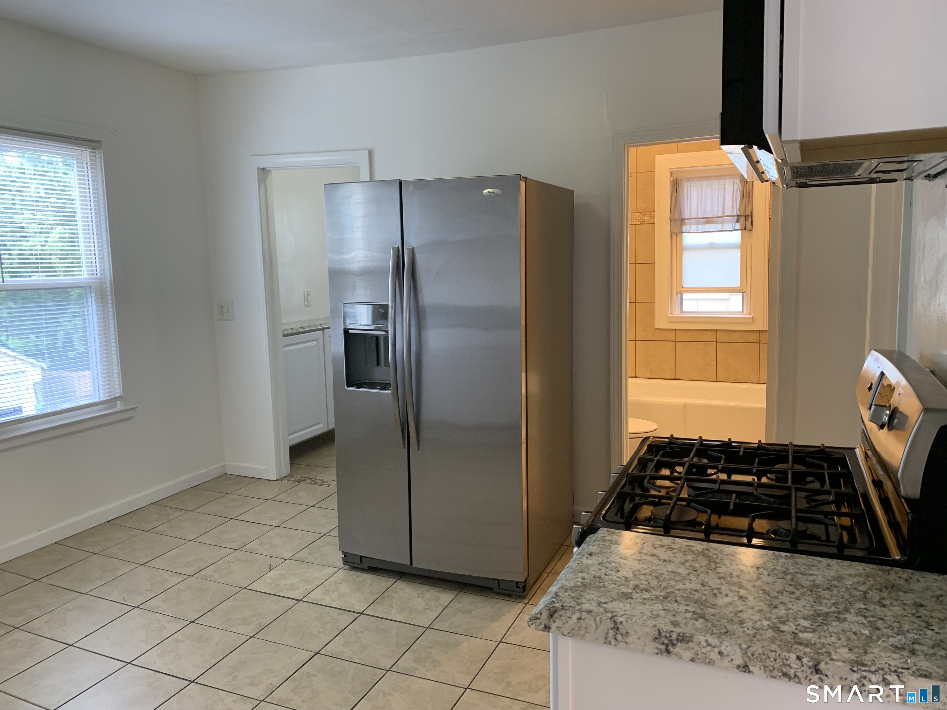 112 Austin Street New Britain, CT 06051 - Photo 8 of 40 a kitchen with stainless steel appliances granite countertop a refrigerator and a stove