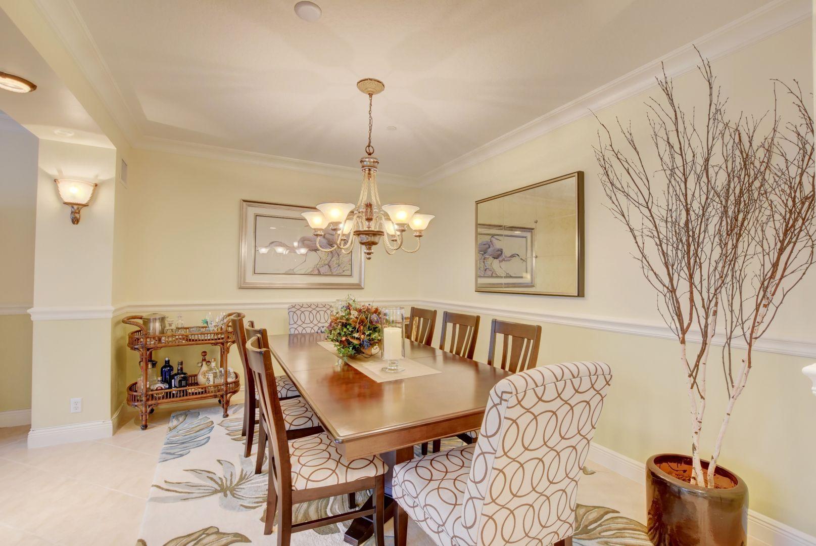5530 Northeast Trieste Way Boca Raton, FL 33487 - Photo 14 of 56 a view of a dining room with furniture