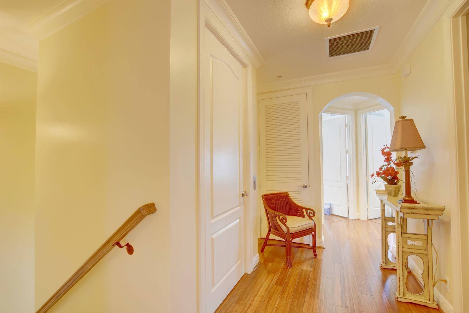 5530 Northeast Trieste Way Boca Raton, FL 33487 - Photo 26 of 56 a living room with furniture and a wooden floor