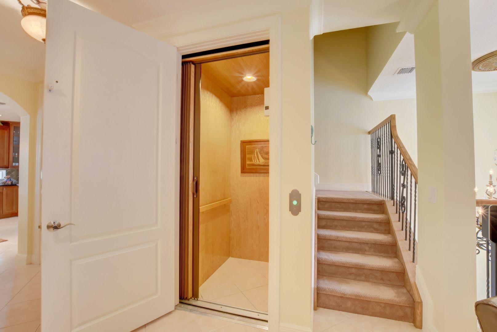 5530 Northeast Trieste Way Boca Raton, FL 33487 - Photo 30 of 56 a view of an entryway with staircase