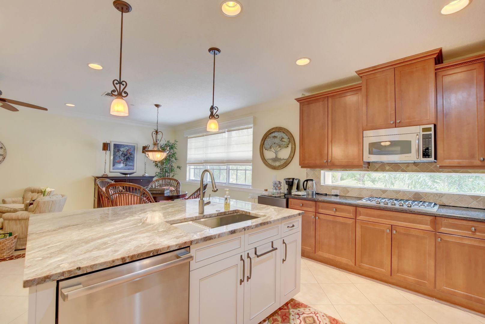 5530 Northeast Trieste Way Boca Raton, FL 33487 - Photo 3 of 56 a kitchen with lots of counter space and a sink