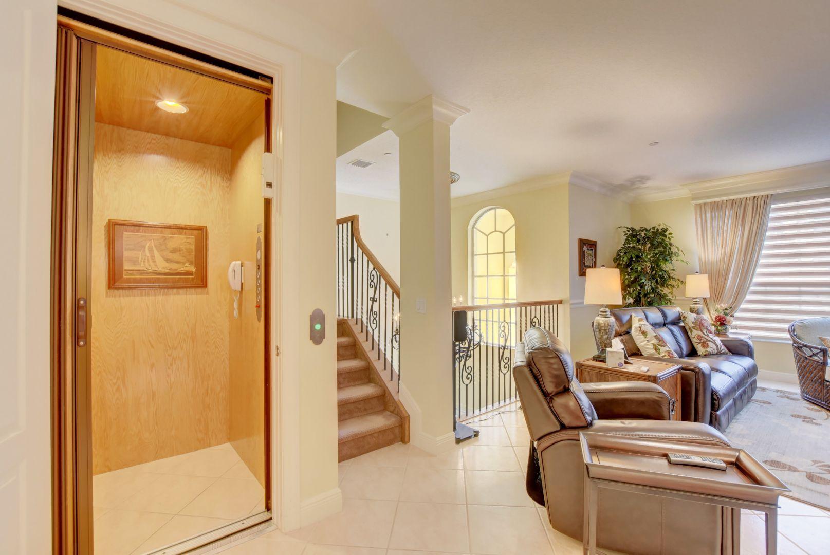 5530 Northeast Trieste Way Boca Raton, FL 33487 - Photo 32 of 56 a living room with furniture and a fireplace