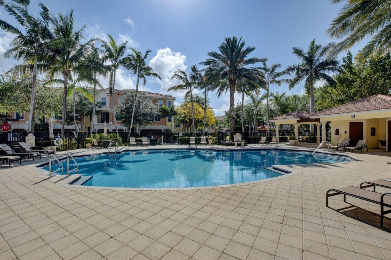 5530 Northeast Trieste Way Boca Raton, FL 33487 - Photo 43 of 56 a view of house with swimming pool and sitting area