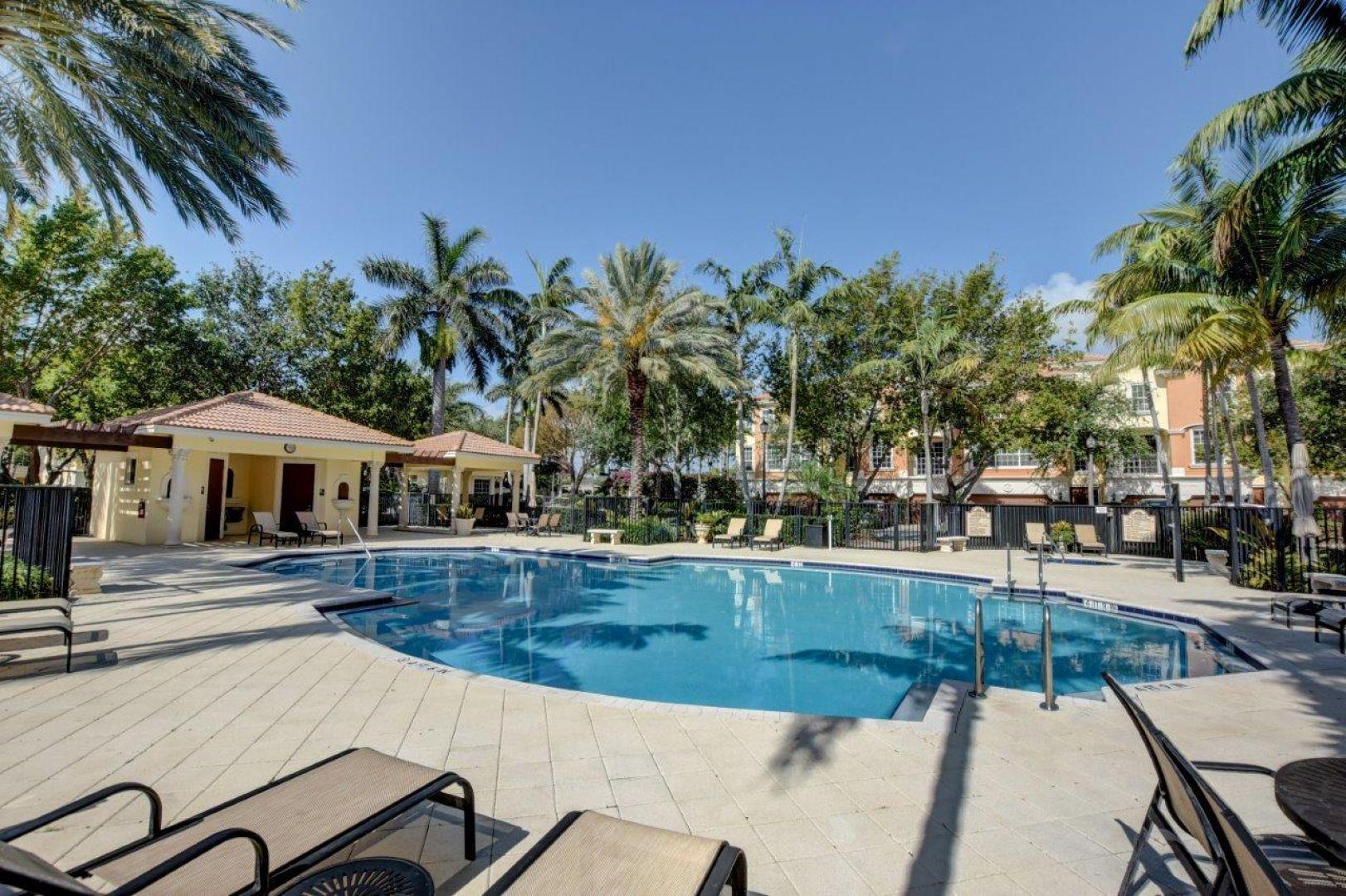 5530 Northeast Trieste Way Boca Raton, FL 33487 - Photo 46 of 56 a view of a house with swimming pool