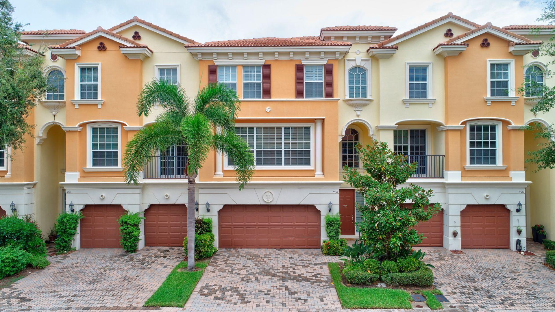 5530 Northeast Trieste Way Boca Raton, FL 33487 - Photo 47 of 56 a front view of a house with garden