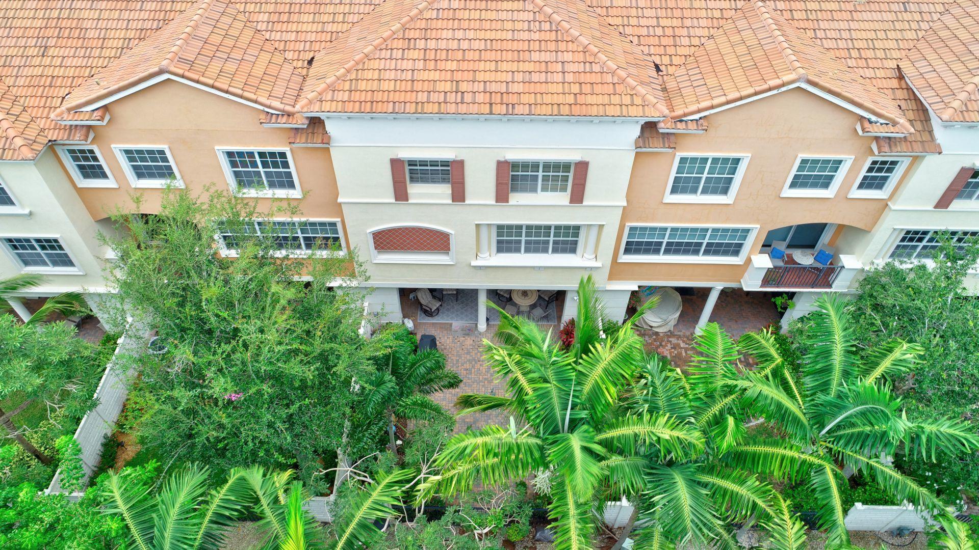 5530 Northeast Trieste Way Boca Raton, FL 33487 - Photo 51 of 56 front view of a house with a yard