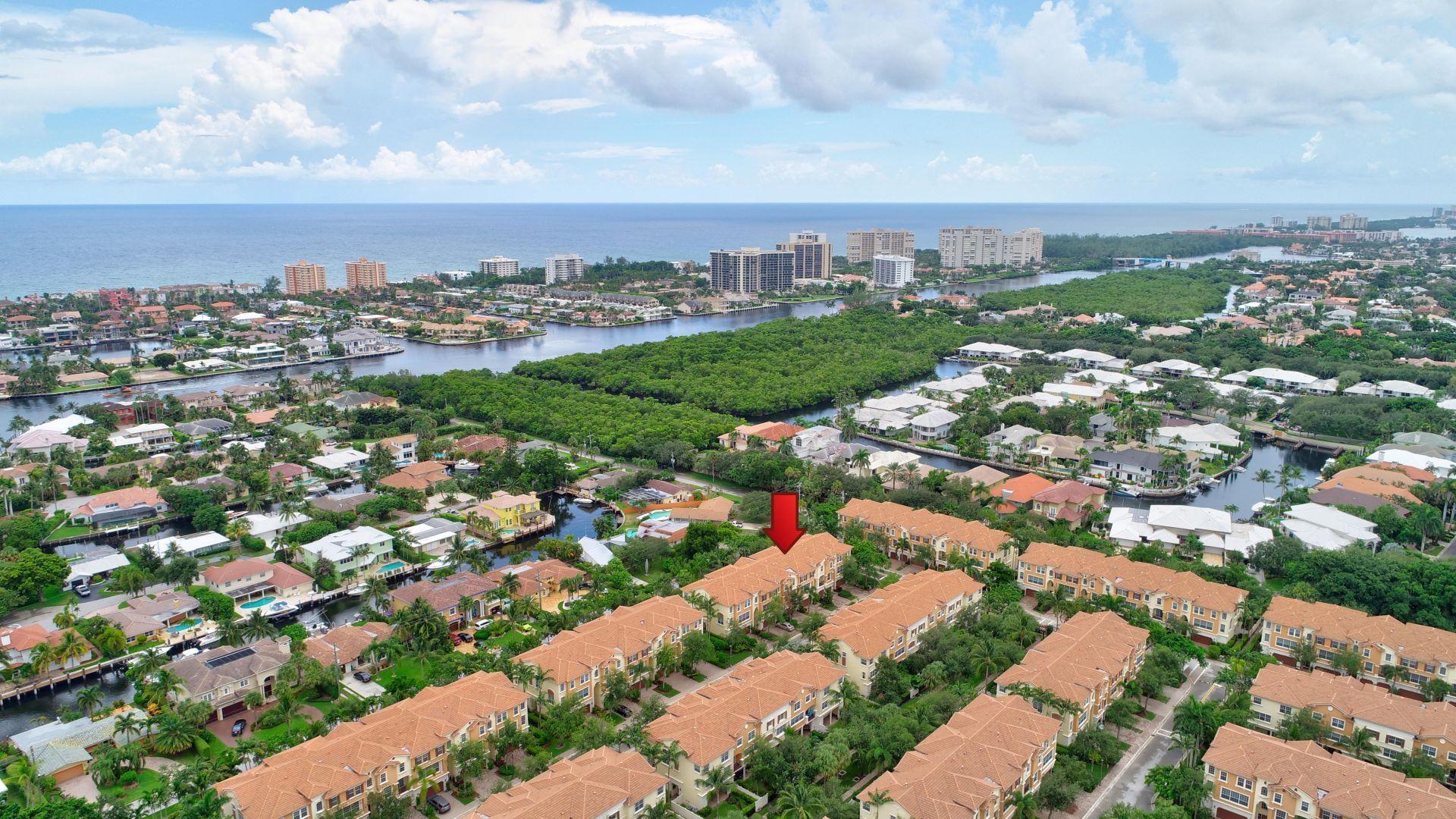 5530 Northeast Trieste Way Boca Raton, FL 33487 - Photo 52 of 56 an aerial view of residential building with green space