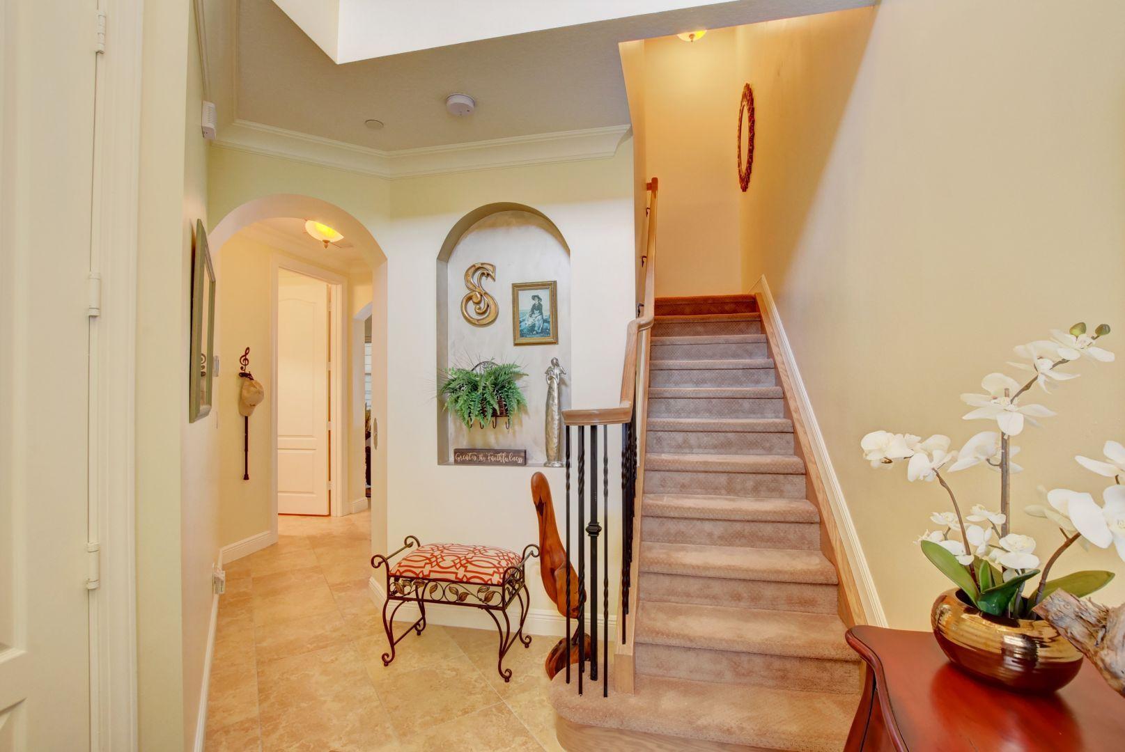 5530 Northeast Trieste Way Boca Raton, FL 33487 - Photo 7 of 56 a view of entryway and hall with wooden floor