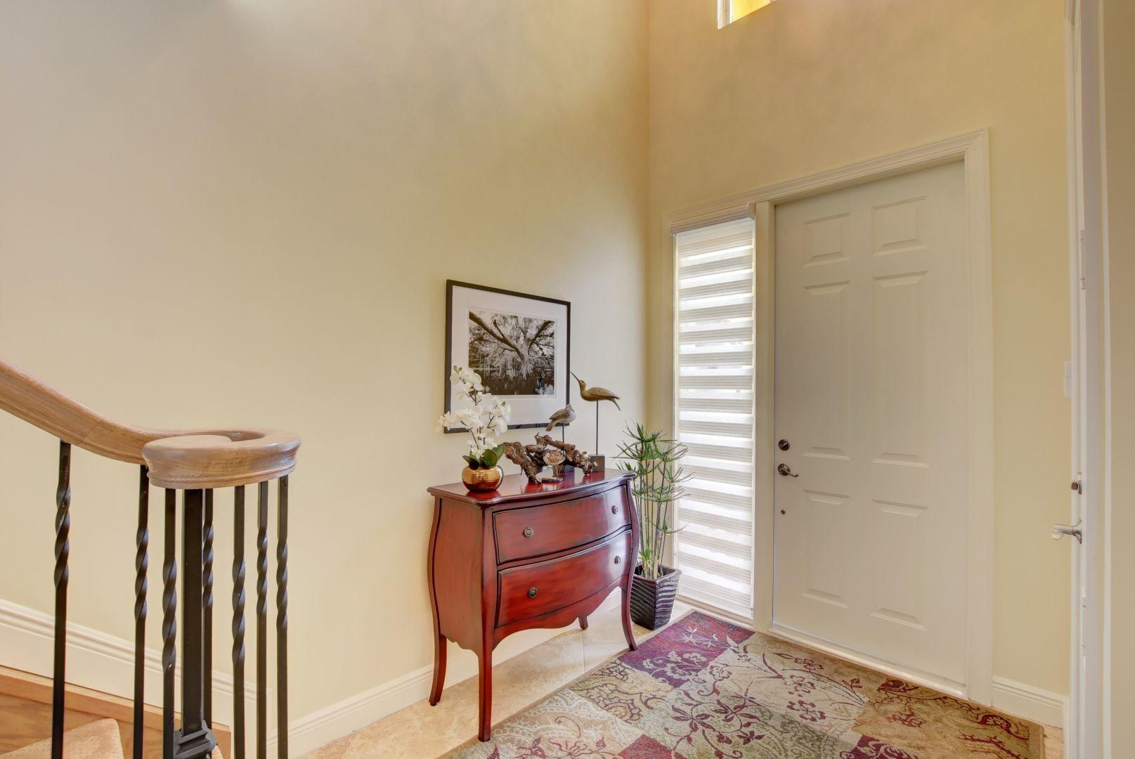 5530 Northeast Trieste Way Boca Raton, FL 33487 - Photo 8 of 56 a living room with furniture and a rug