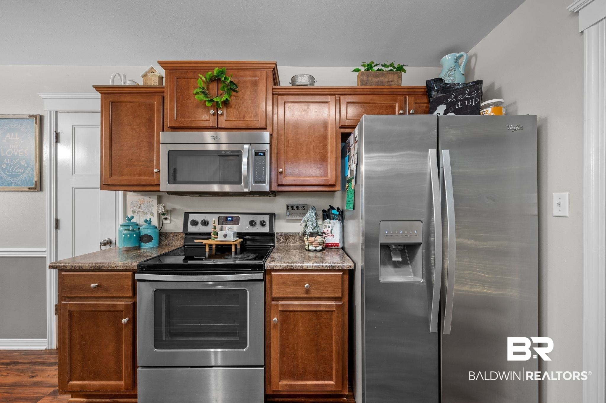 9366 Fox Run Court Semmes, AL 36575 - Photo 14 of 29 Kitchen with dark wood-type flooring and appliances with stainless steel finishes