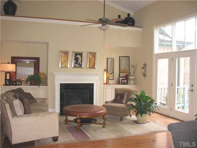 8214 Lloyd Allyns Way Raleigh, NC 27615 - Photo 5 of 16 The vualted ceiling adds to the spaciousness of the family room. Glass doors open to the deck. Living Room