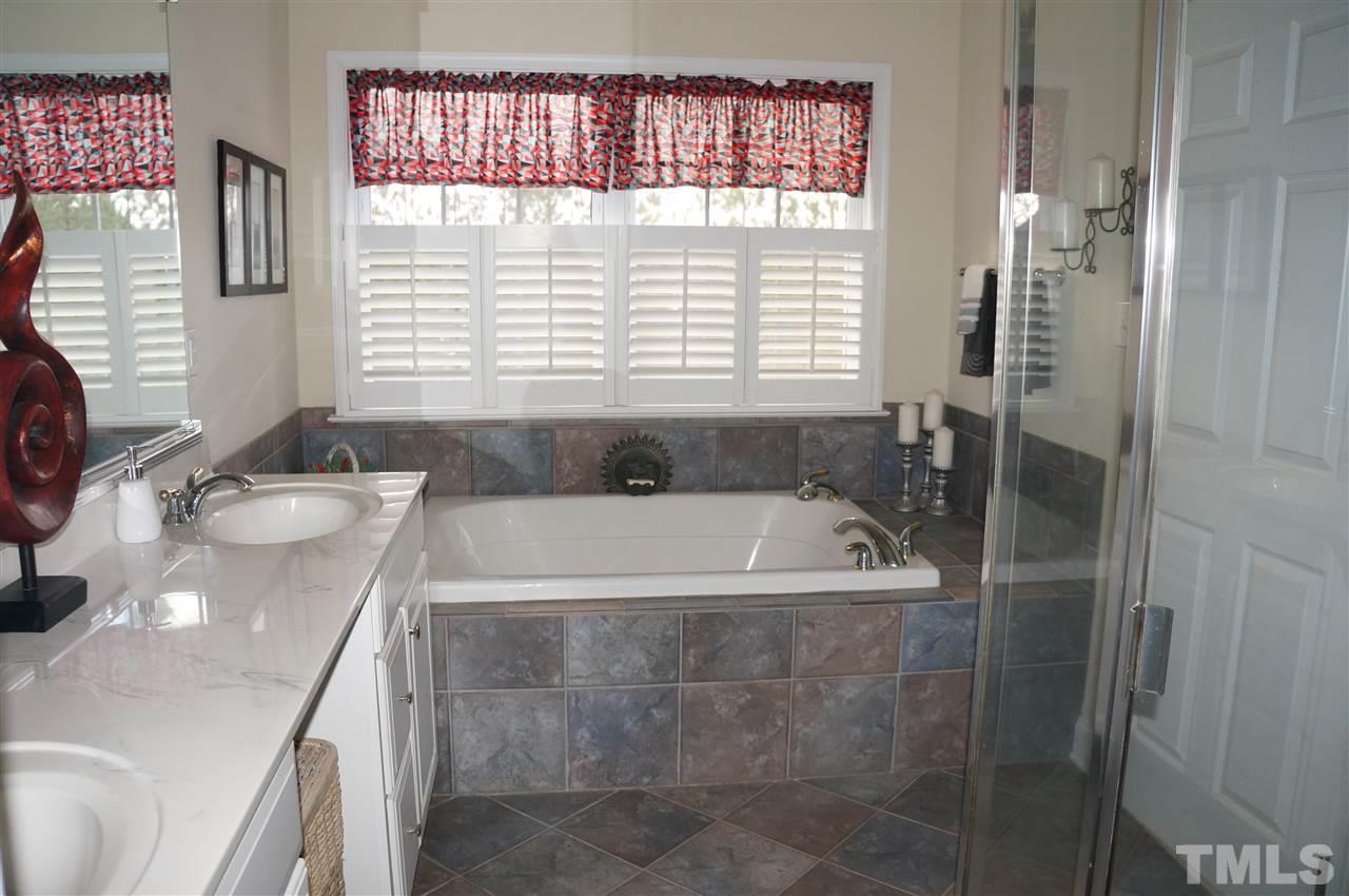 10913 Clovermill Circle Raleigh, NC 27617 - Photo 14 of 25 A large soaking tub accents the Luxury Master Bath. Beautiful designer tile!