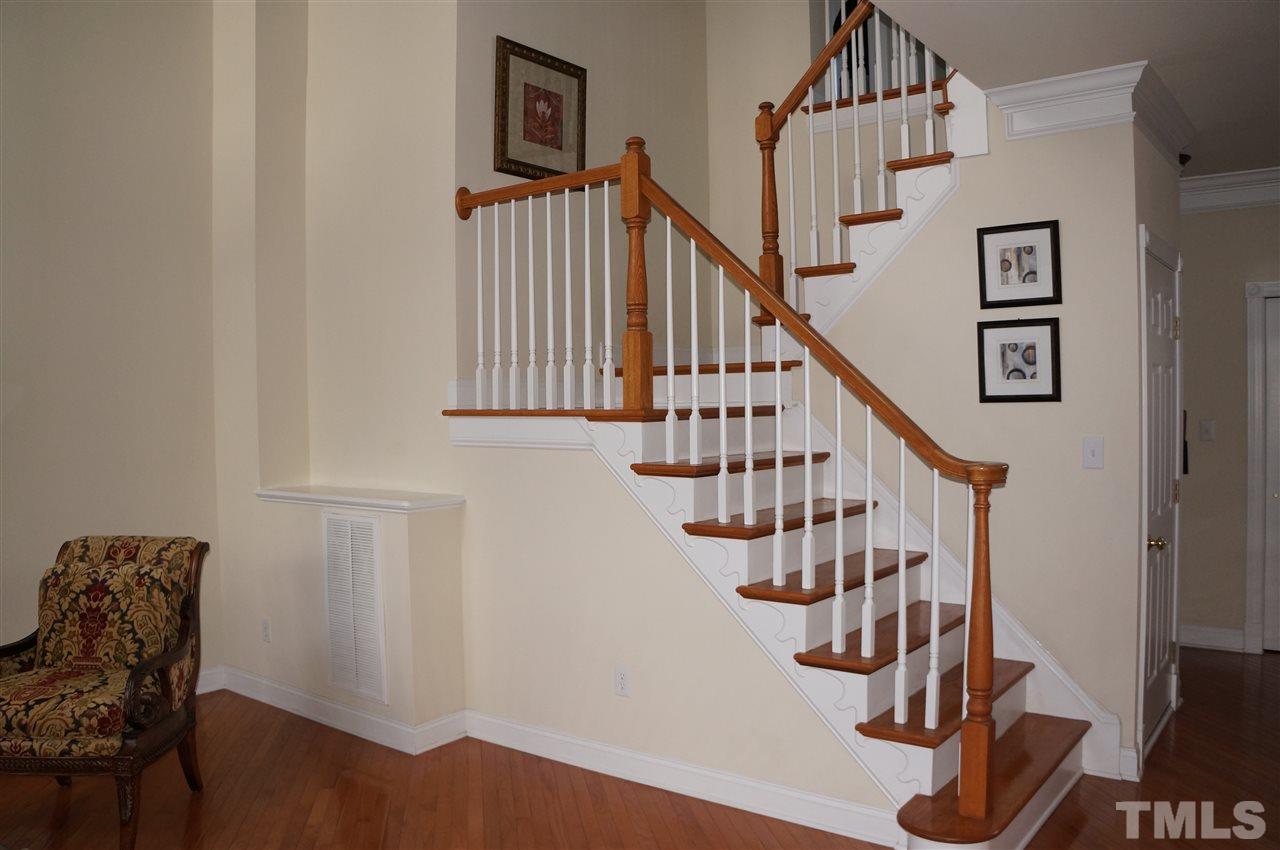 10913 Clovermill Circle Raleigh, NC 27617 - Photo 17 of 25 Architectually appealing staircase to the 2nd level.