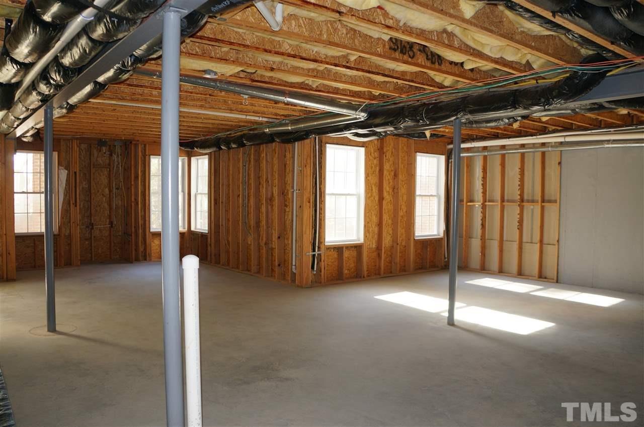 10913 Clovermill Circle Raleigh, NC 27617 - Photo 18 of 25 Plumbed for a full bathroom and or kitchen area, and also framed for a 2nd fireplace. Great expansion space.