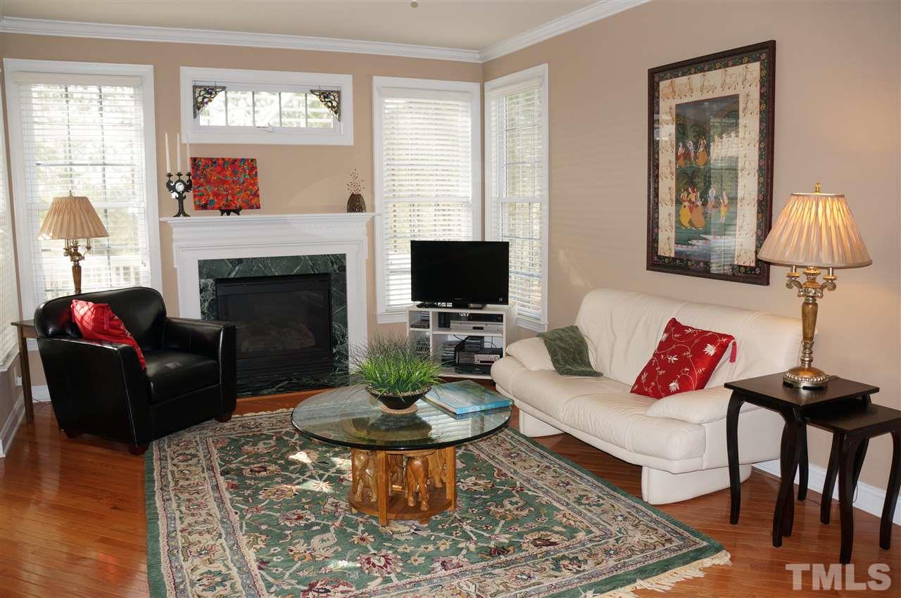 Accented by the gas log fireplace, this large area is just off the kitchen/breakfast area.