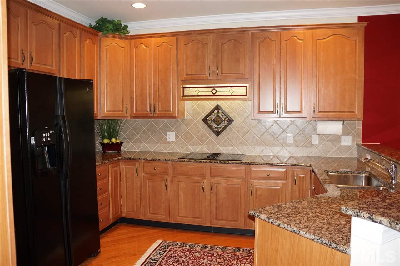10913 Clovermill Circle Raleigh, NC 27617 - Photo 8 of 25 Granite countertops, tiled backsplash, down draft cooktop & more!