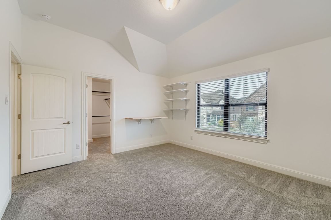 2928 Birdcall Path Leander, TX 78641 - Photo 23 of 36 an empty room with windows and closet