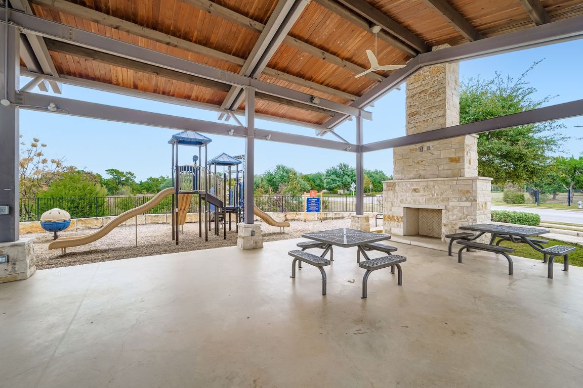 2928 Birdcall Path Leander, TX 78641 - Photo 34 of 36 a view of a patio with a table and chairs
