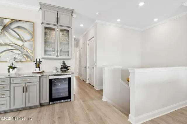 a living room with furniture flat screen tv and window
