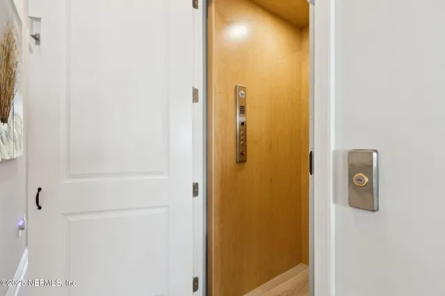 a living room with furniture a flat screen tv and a large window