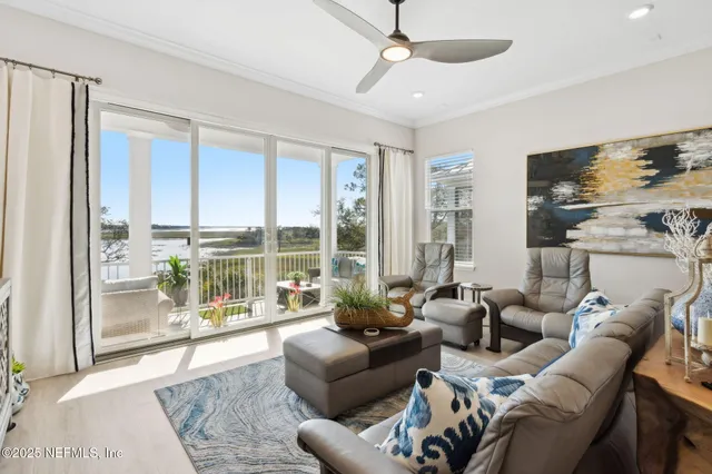 a view of a balcony with couch and wooden floor