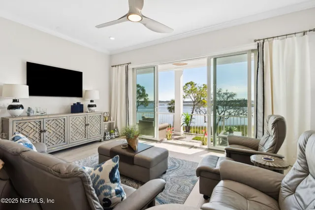 a balcony with wooden floor and outdoor seating