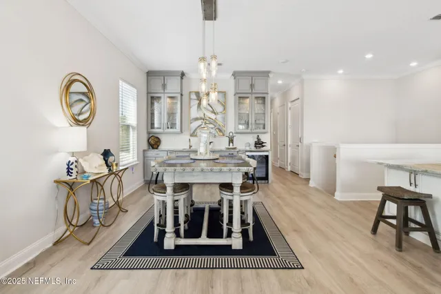 a kitchen with stainless steel appliances kitchen island granite countertop a sink and cabinets