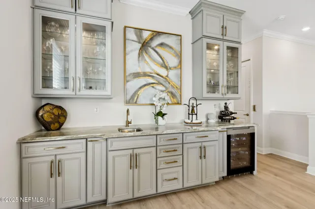 a large kitchen with kitchen island a sink appliances and a counter space