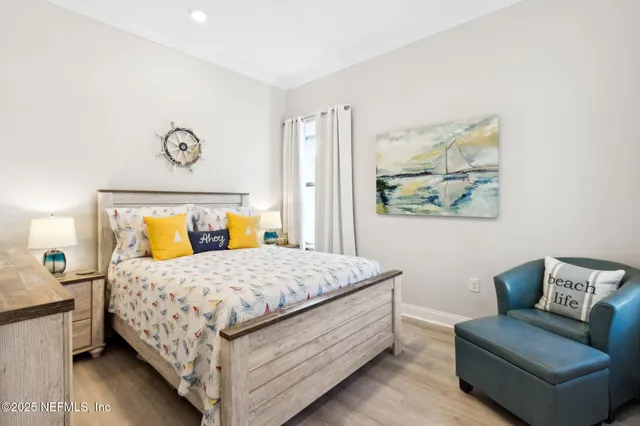 a bedroom with a large bed and a large window