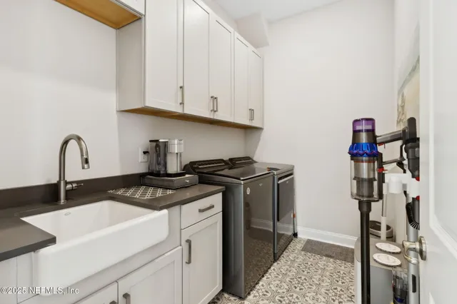 a living room filled with furniture and a floor to ceiling window
