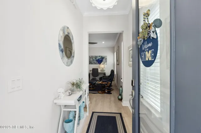 a living room with furniture a rug and a window