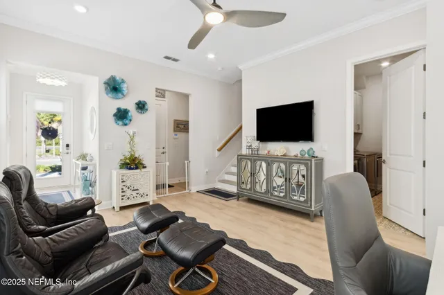 a bedroom with a bed and a flat tv screen on dresser