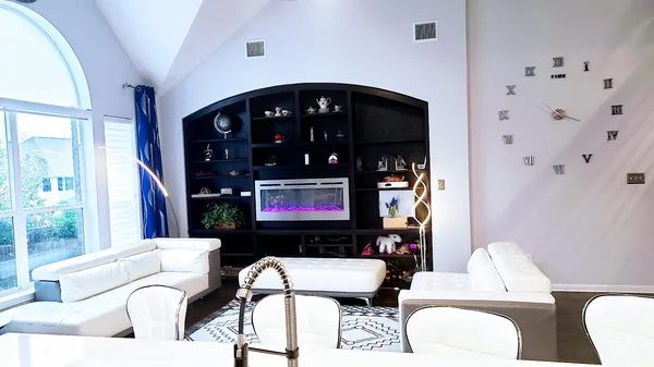 a living room with furniture and a fireplace